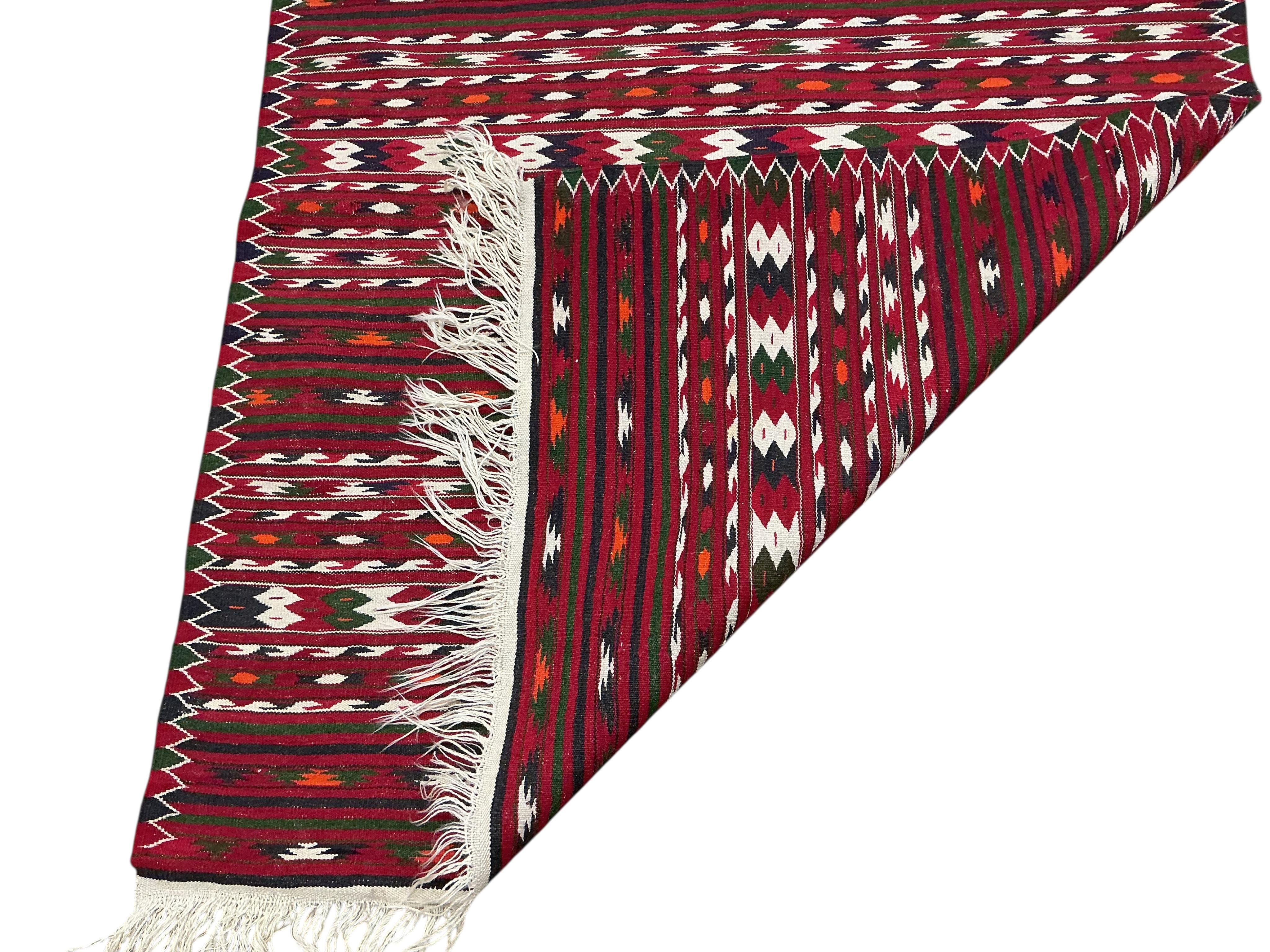 A Kilim flatweave red ground rug, 190 x 120cm